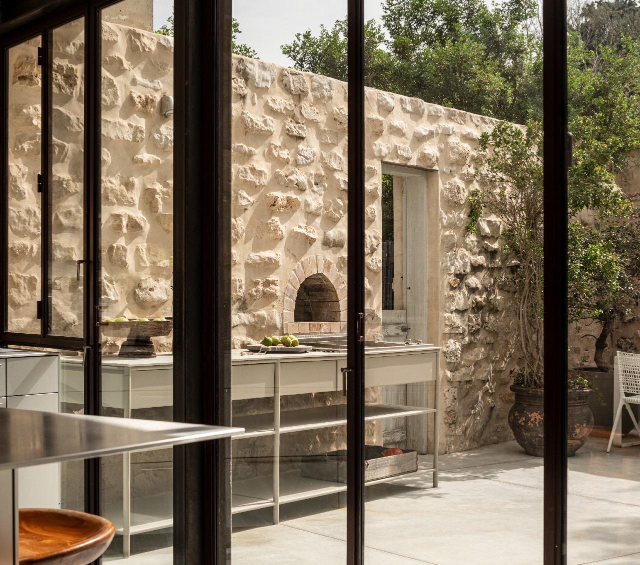 CSL stainless counter against a stone wall