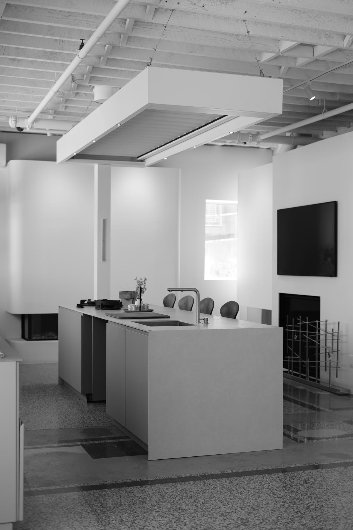 The Capo Cuòco Canada studio at 680 Caledonia Rd, Toronto — display island, extractor hood and fireplace