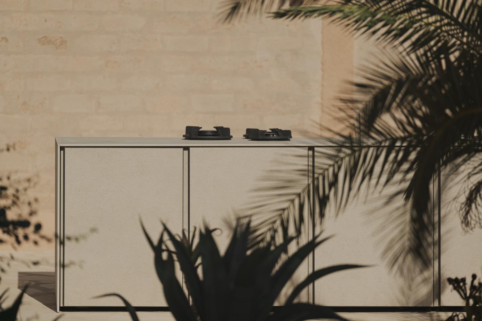 Beige STRATO cabinet in palm shadow
