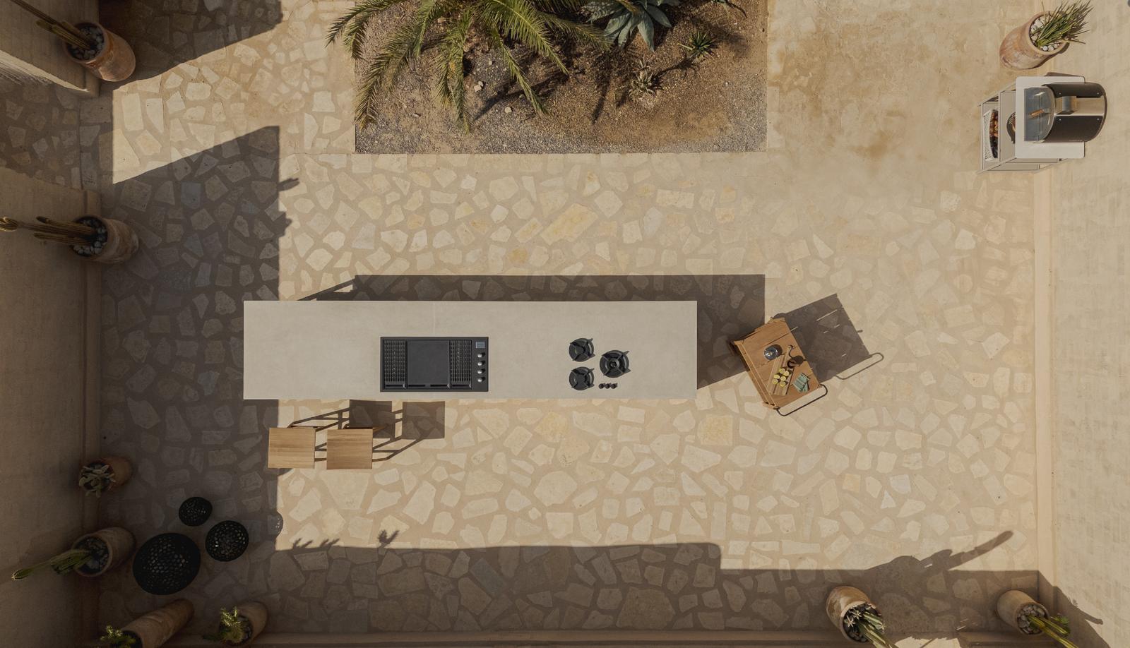 Aerial top-down view of STRATO desert courtyard kitchen
