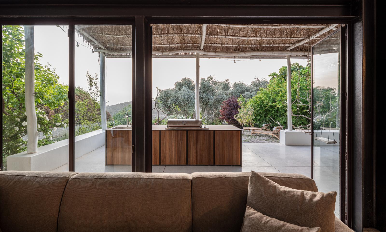 View through pergola to STRATO kitchen